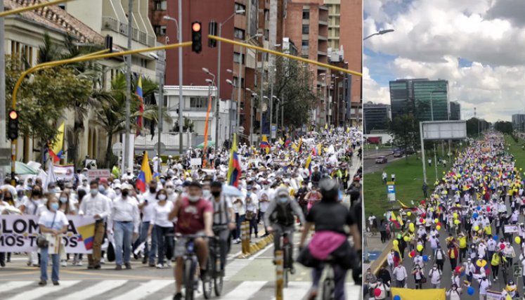 Hombres y mujeres de blanco caminan con pancartas que piden "paz" o "no más bloqueos" de carreteras y entonando oraciones. / Foto: El Colombiano